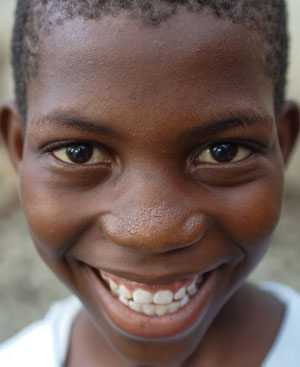 Haitian child smiling wide
