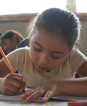 Nicaraguan girl learning at school with OneChild