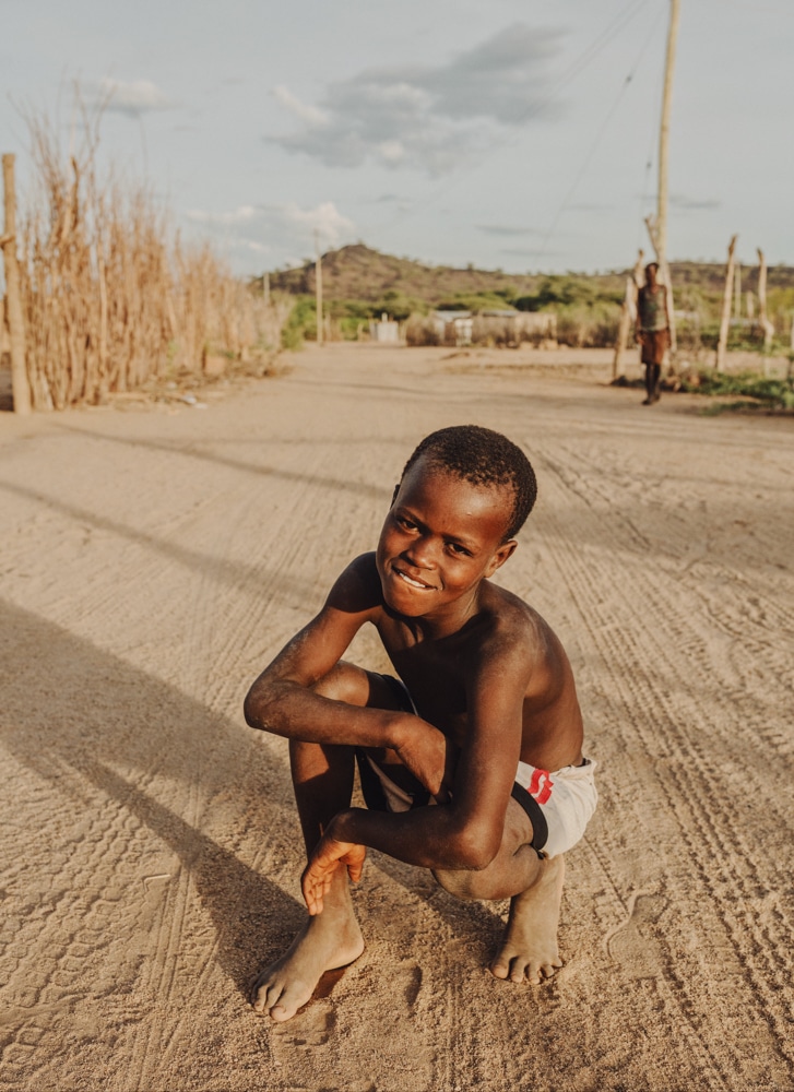 Turkana boy crouching