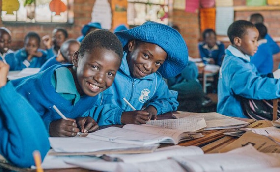 Zimbabwe children in class wearing bright blue
