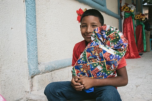 Christmas in Honduras - boy with gift