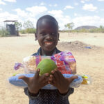Kenya hope centers christmas celebration boy with gifts