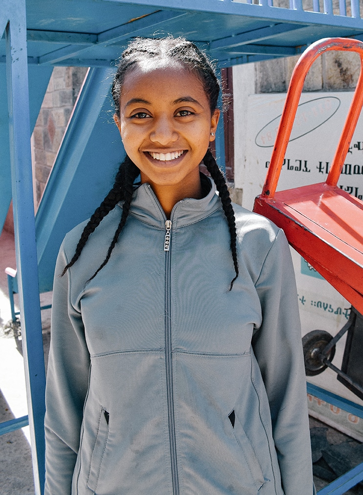 A sponsored girl in Ethiopia rejoices at a opportunity she received to pursue her education comfortably, despite living in poverty