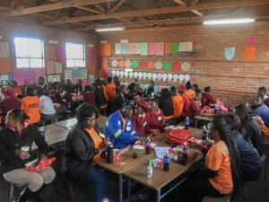 Kids and adults sharing a meal together at a Hope Center in Zimbabwe