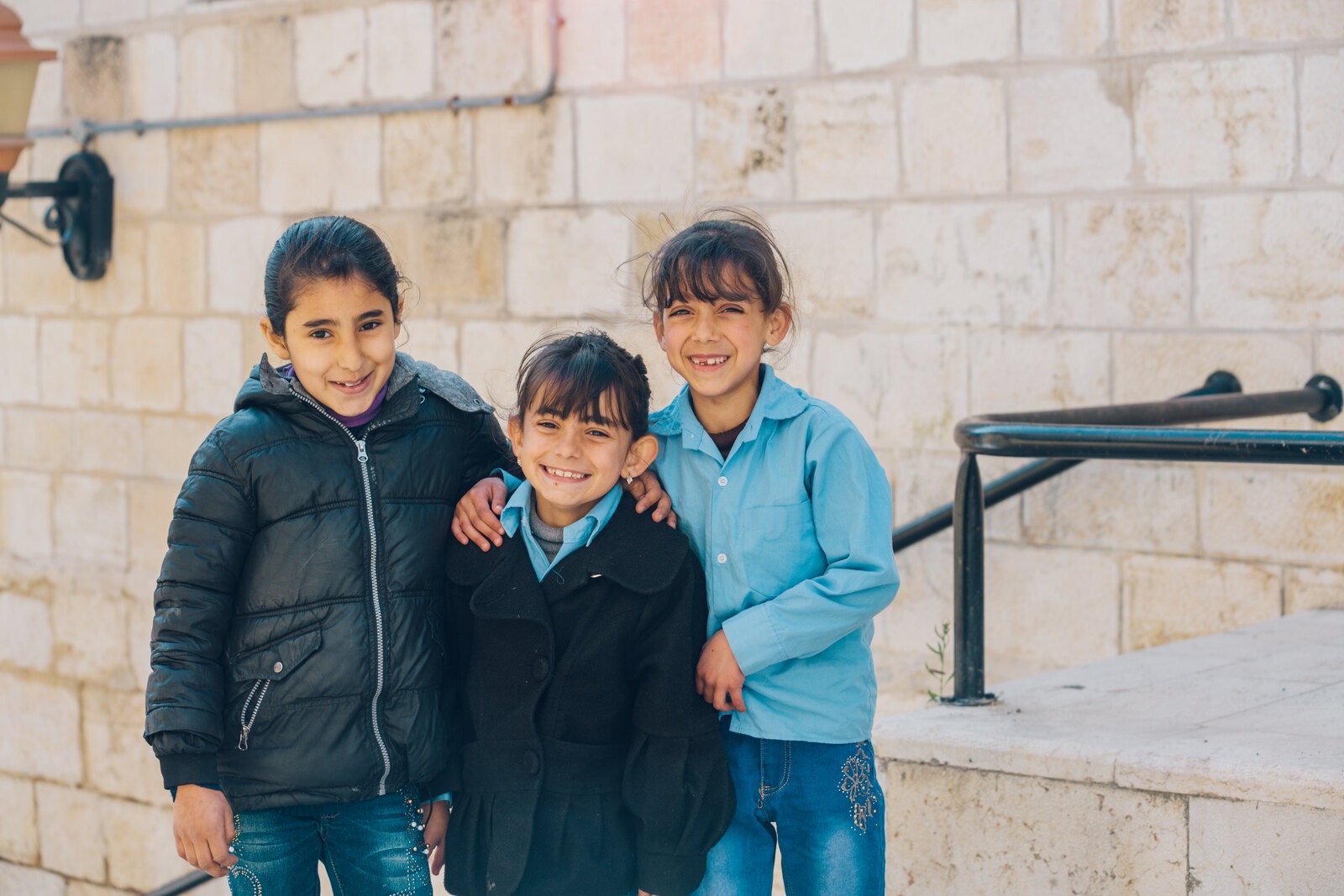 Three friends walking to school
